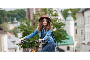 Female traveller on electric scooter, a Person Photo by HalfPoint