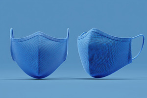 Two blue fabric face masks mockup on a blue background, a Mask Mockup by Textures & Backgrounds