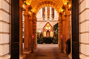 Gingerbread house with festive lights and Christmas trees creating a holiday di, a Photo by Studio ANNA