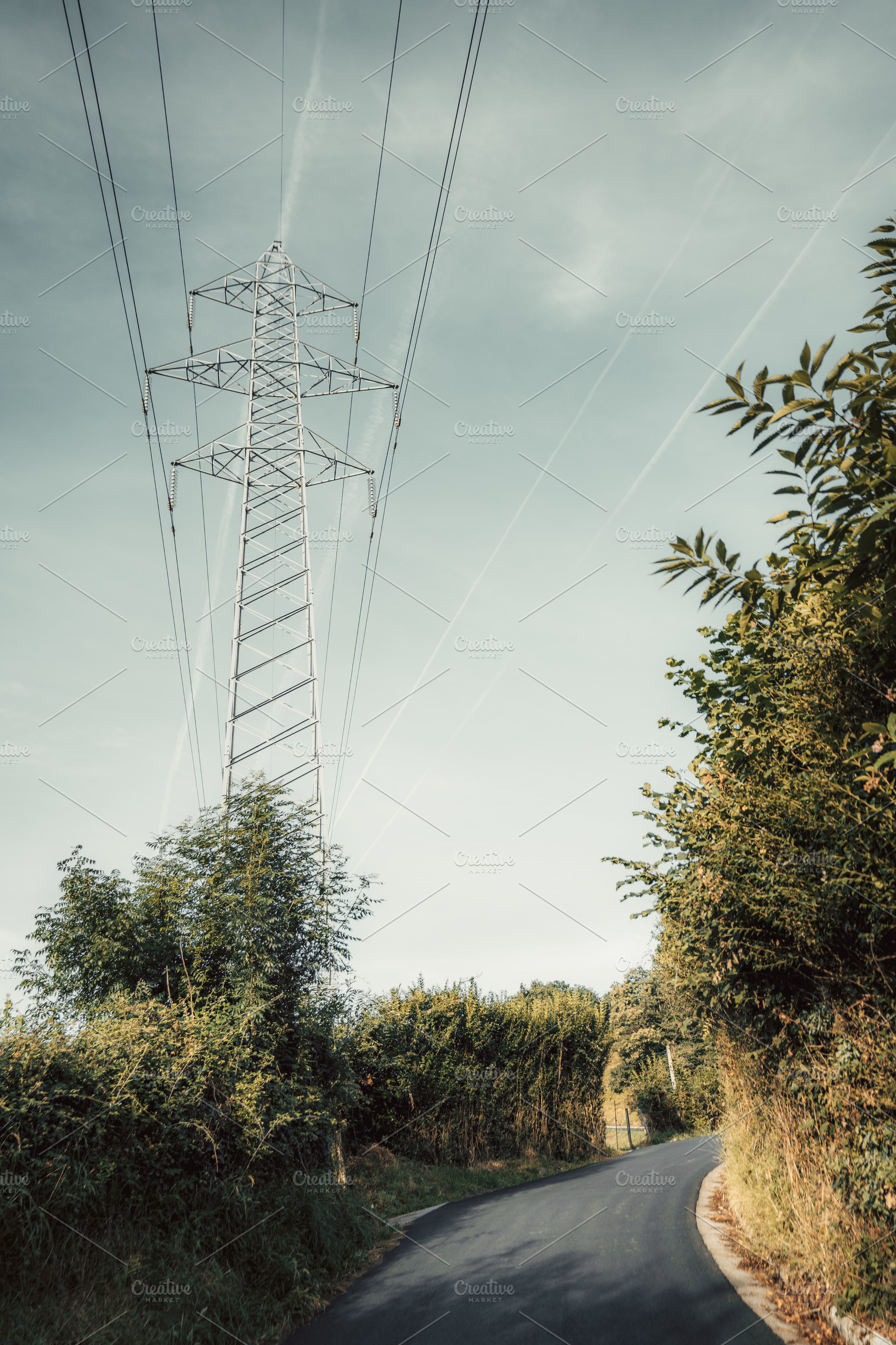 Power line over rural road, a Technology Photo by SkyNext