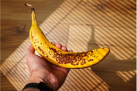 Brightly colored banana with brown