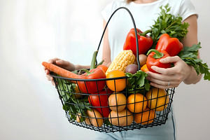 Woman Holding Basket Full of Fresh P, a Food & Drink Photo by Stock Shape