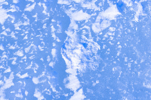 Natural blue ice with snow, rough frozen winter surface, a Photo by MDBildes