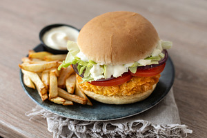 Crispy chicken burger with french fries and dipping sauce on plate, a Food & Drink Photo by etorres69