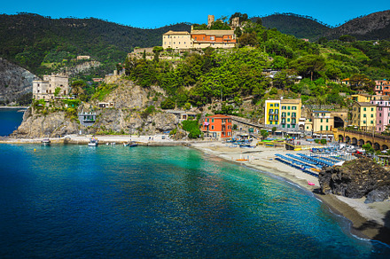 Ligurian beach and colorful houses, a Nature Photo by Alpine Dreams