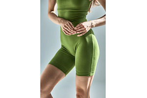 Fitness woman in green sportswear, a Beauty & Fashion Photo by wip3out