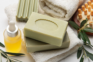 Natural olive oil soap, essential oil and white towels creating, a Health & Medical Photo by Olena Rudo