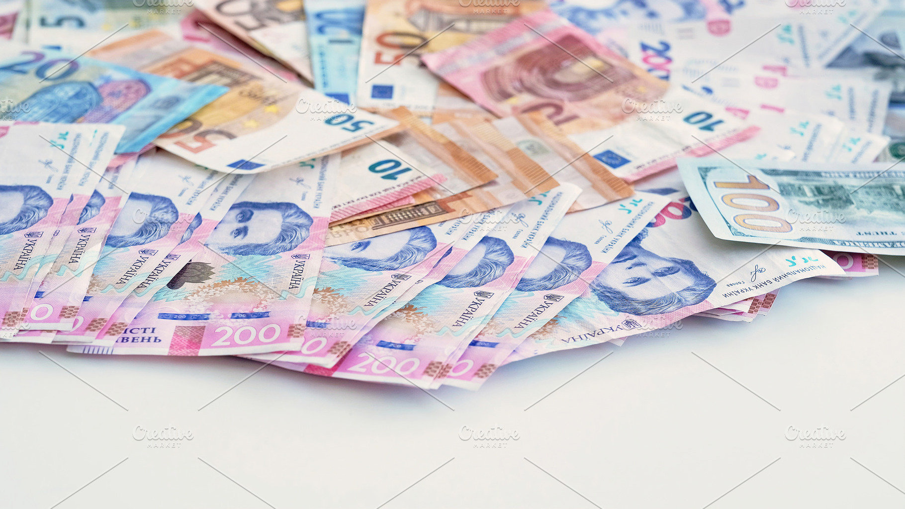 Cash money foreign currency euro dollar hryvnia, a Business Photo by Photo Drive Studio