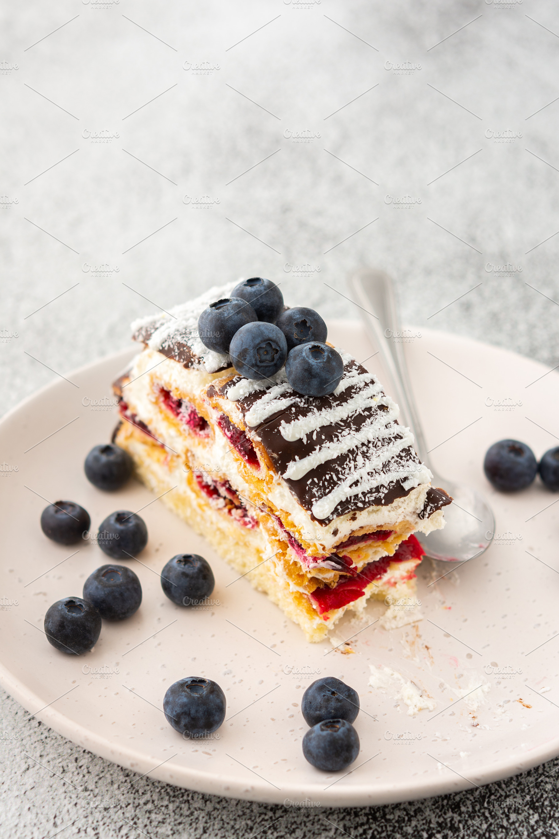 Piece of cake with blueberries, a Food & Drink Photo by Pandateam