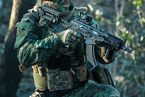 Soldier aiming with airsoft gun during military training exercise in forest, a Sports & Recreation Photo by Antonio Gravante Market