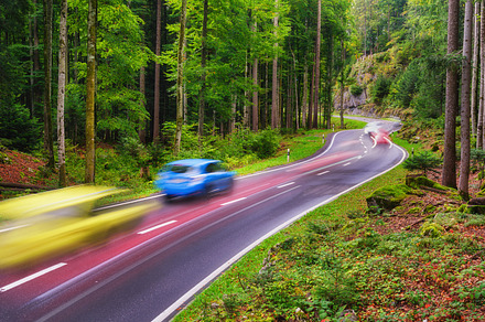 Road among the forest. Fast traffic, a Transportation Photo by Landscape and travel