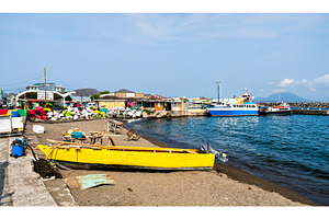 Small fishing boat on the beach in, a Transportation Photo by Leonid Andronov