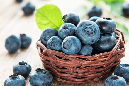Blueberries on old wooden background, a Food & Drink Photo by Olena Rudo
