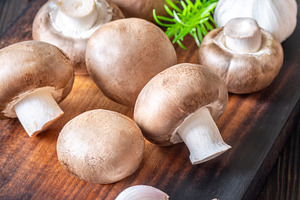Raw brown champignon mushrooms with, a Food & Drink Photo by Alexander Prokopenko