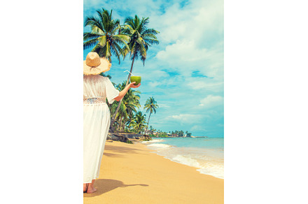 Girl on the beach drinks coconut, a Person Photo by yanadjana