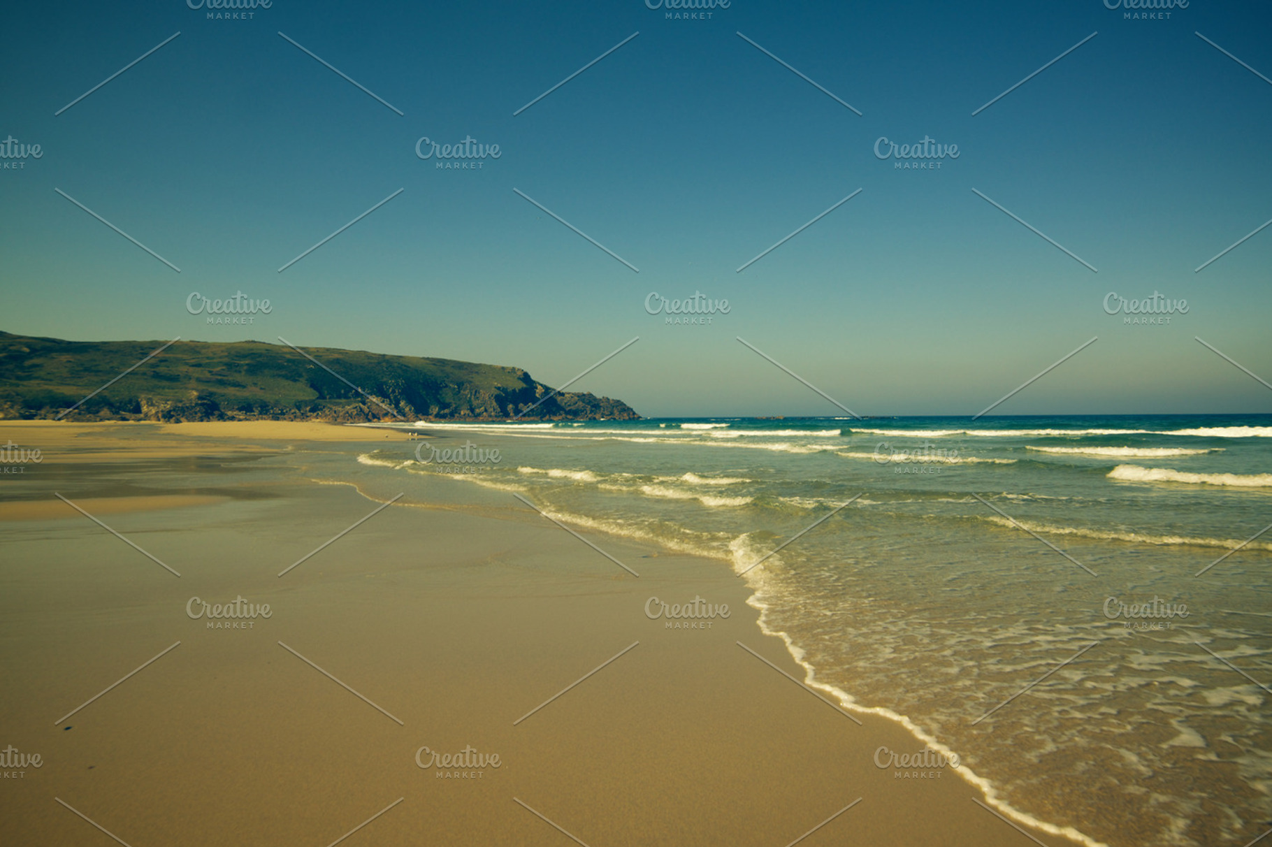 Beach containing empty beach, sand, and sea