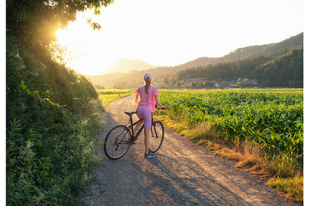 Woman on mountain bike on gravel, a Sports & Recreation Photo by den-belitsky