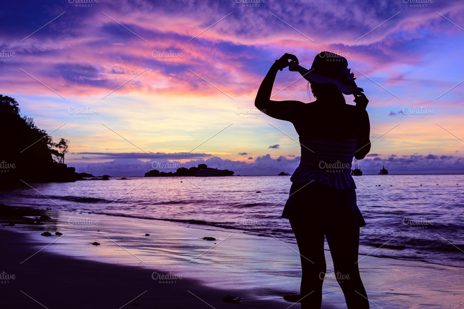 Girl on the beach at sunrise containing beach, sunrise, and sea, a Person Photo by yongkiet jitwattanatam
