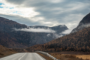 Road Leading to Mountains with Fog, a Photo by Fascinadora