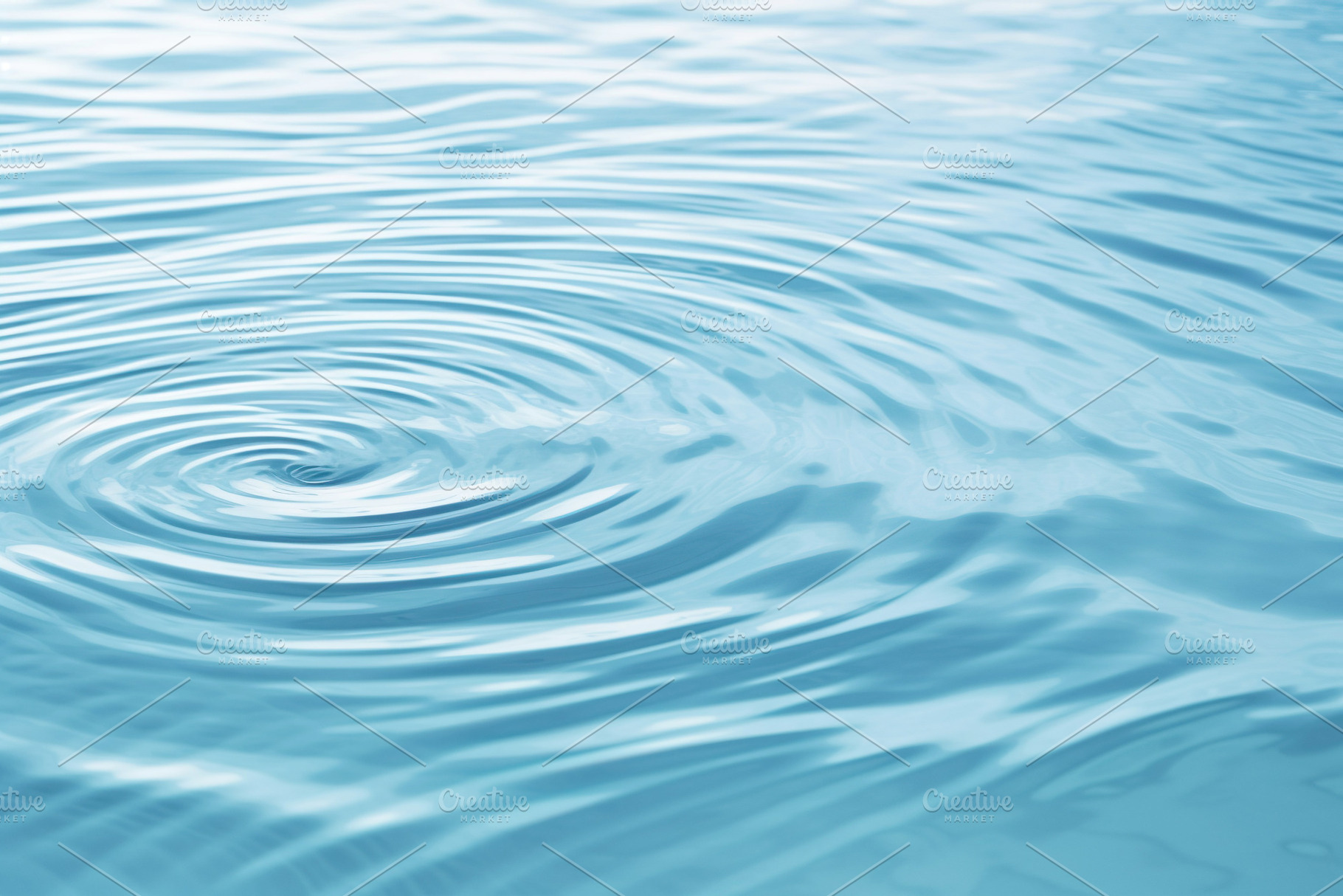 Tranquil Blue Water Surface with Soft Circles, a Background Photo by Iconogenic