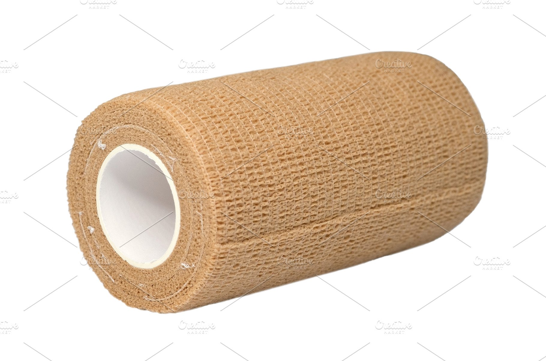 Beige cohesive bandage roll isolated, a Health & Medical Photo by Rohan Photography