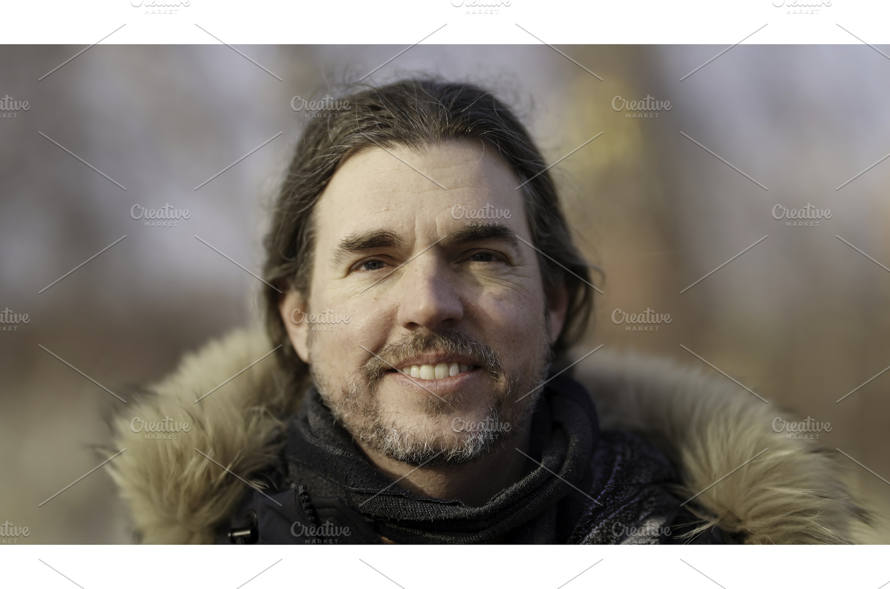 Portrait of smiling man with long, a Person Photo by Media Whale Stock