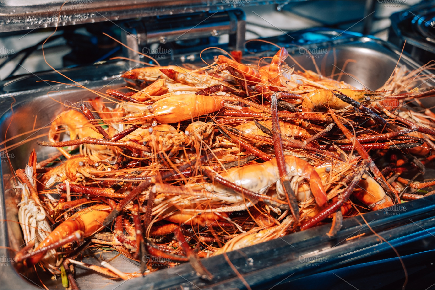 Large pile of cooked orange giant, a Food & Drink Photo by Jan Jack Russo Media