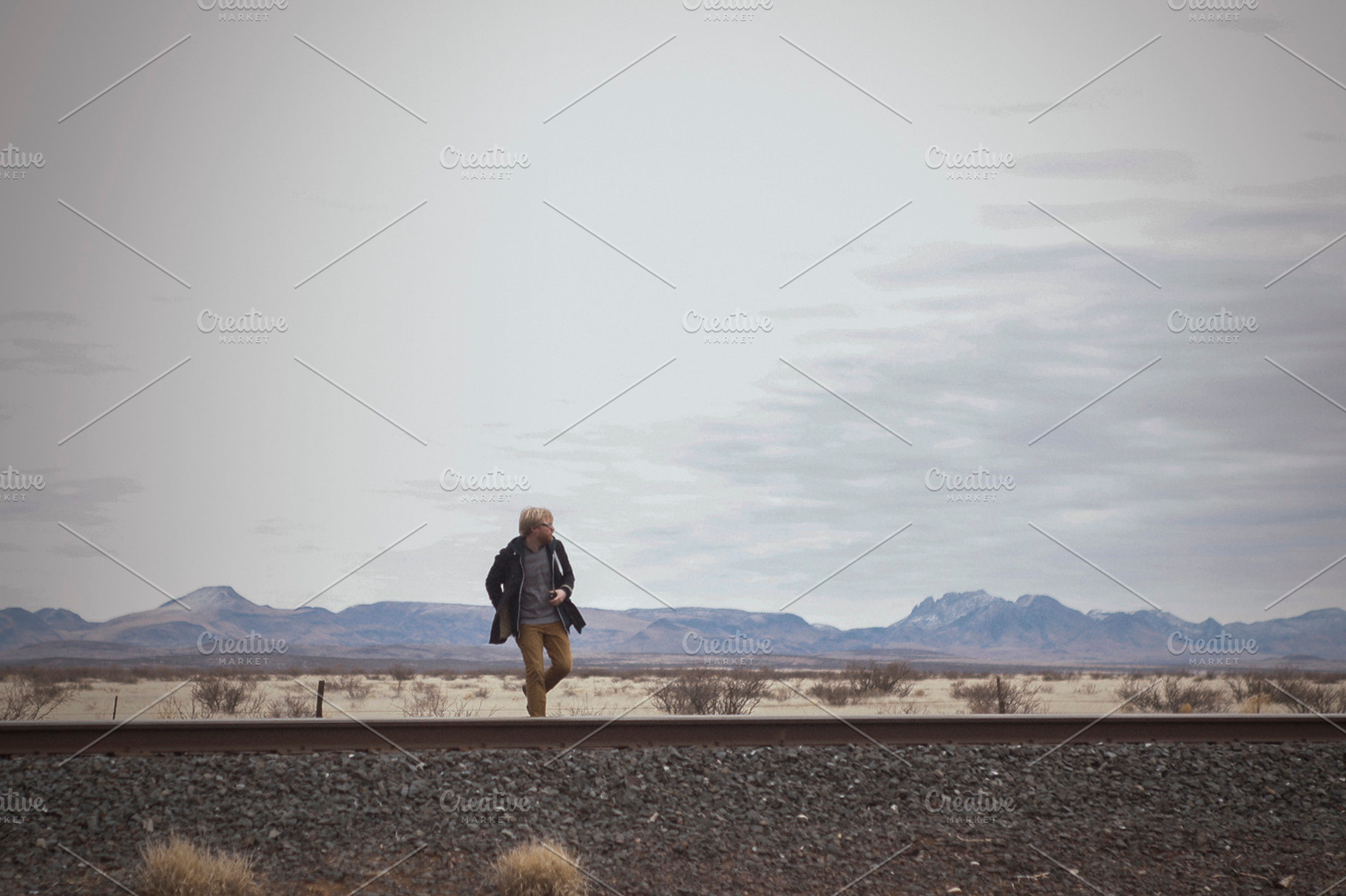 A Man Runs Across Railroad Tracks