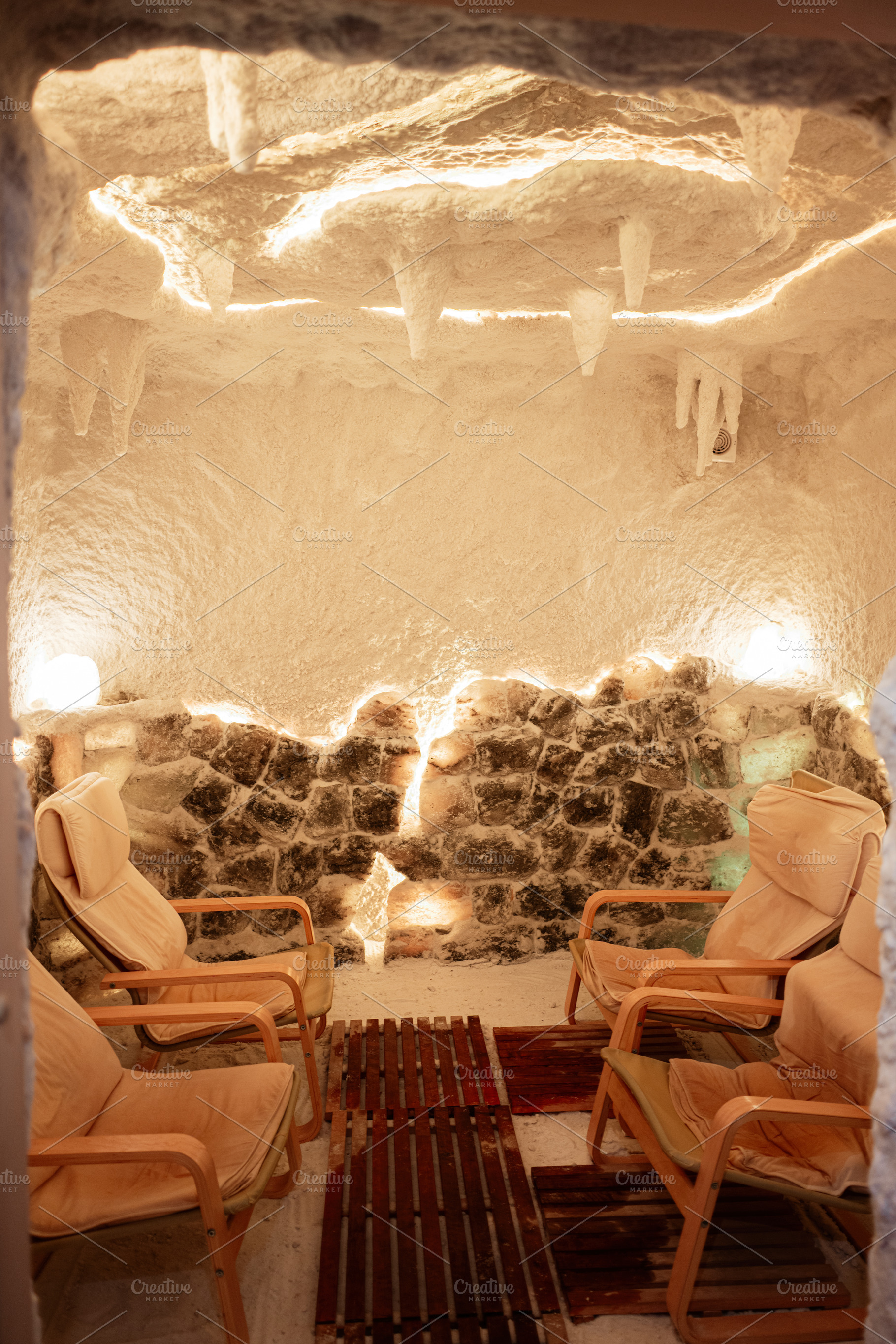 Relaxing interior of a therapeutic salt cave with comfortable seating and soft, a Photo by AS photostudio