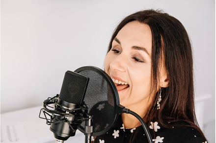 Portrait of beautiful woman sings a