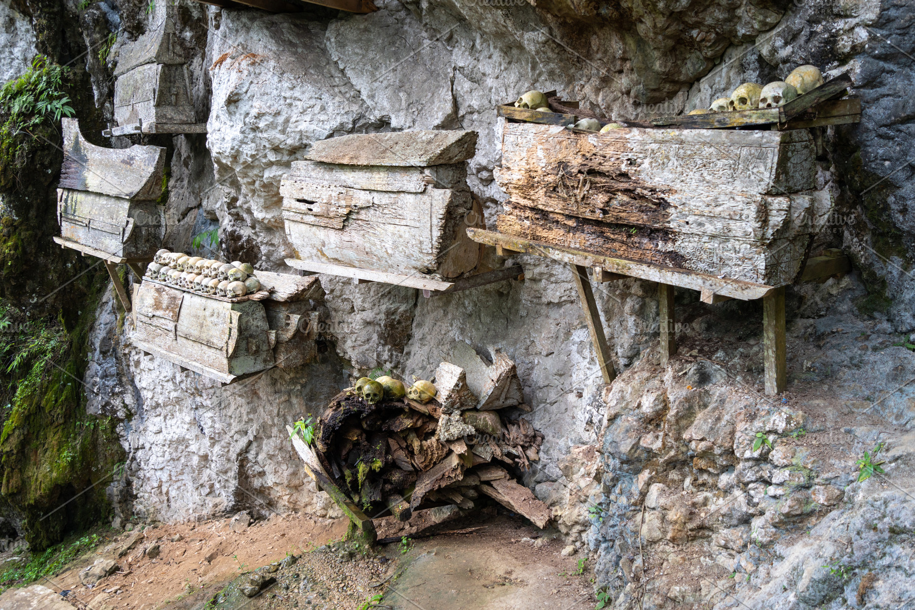 Toraja tombs and skulls in cave sanctuary, Sulawesi, Indonesia, an Architecture Photo by GoodGoods