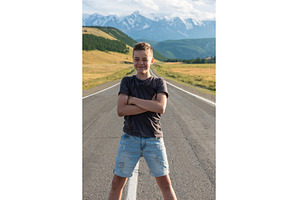Smiling teen boy on the road in, a Person Photo by Jan Jack Russo Media
