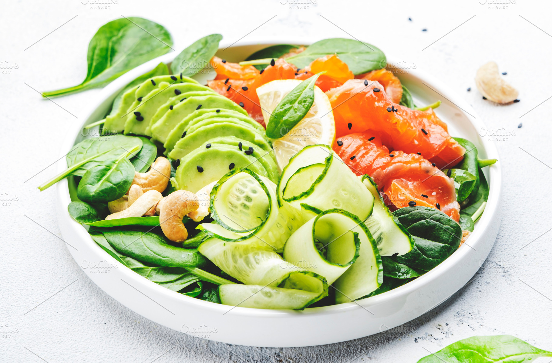 Salmon salad for ketogenic diet with avocado, spinach, cucumber,, a Food & Drink Photo by 5PH