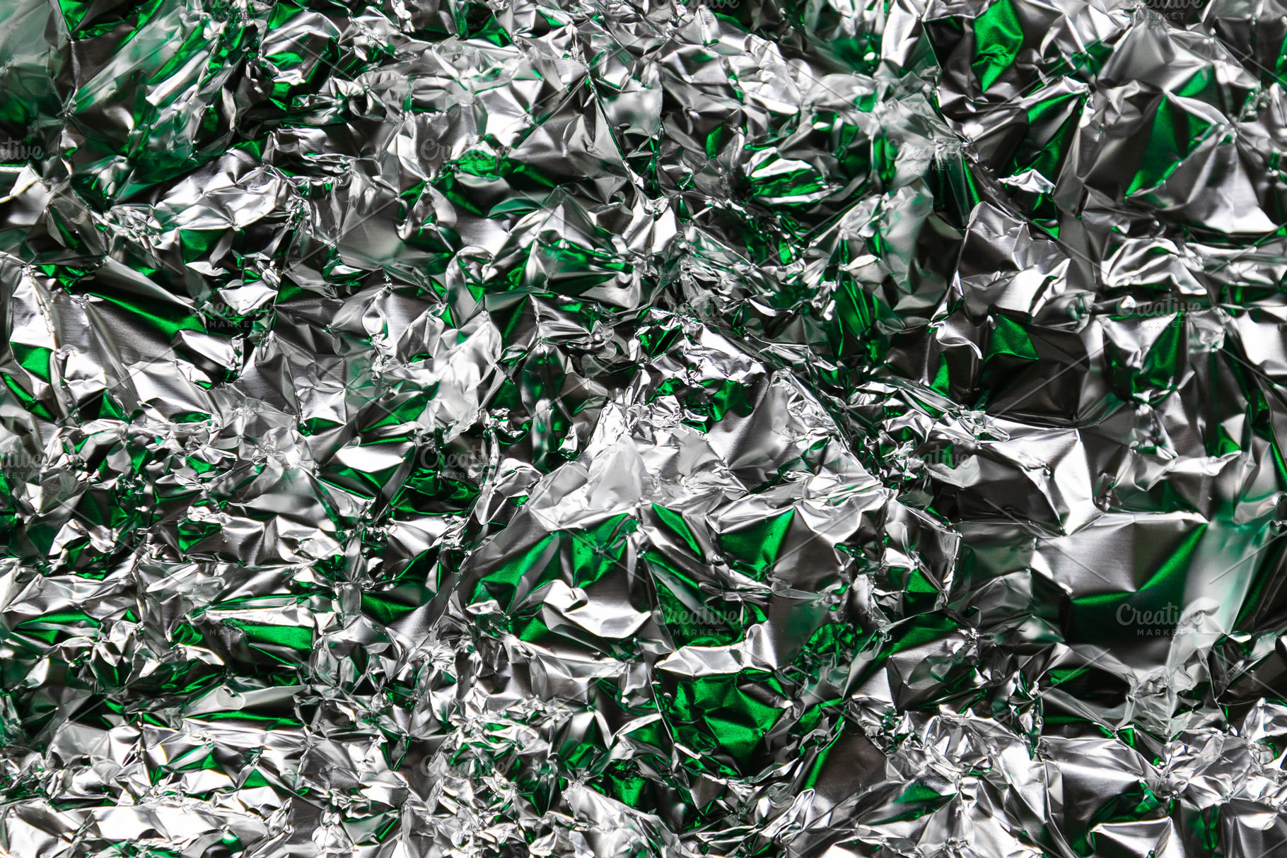 Crumpled foil with silver and green, a Background Photo by Edalin's Store