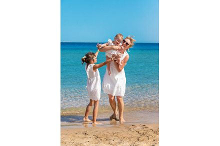 Mother with her daughters at sea, a Person Photo by yanadjana