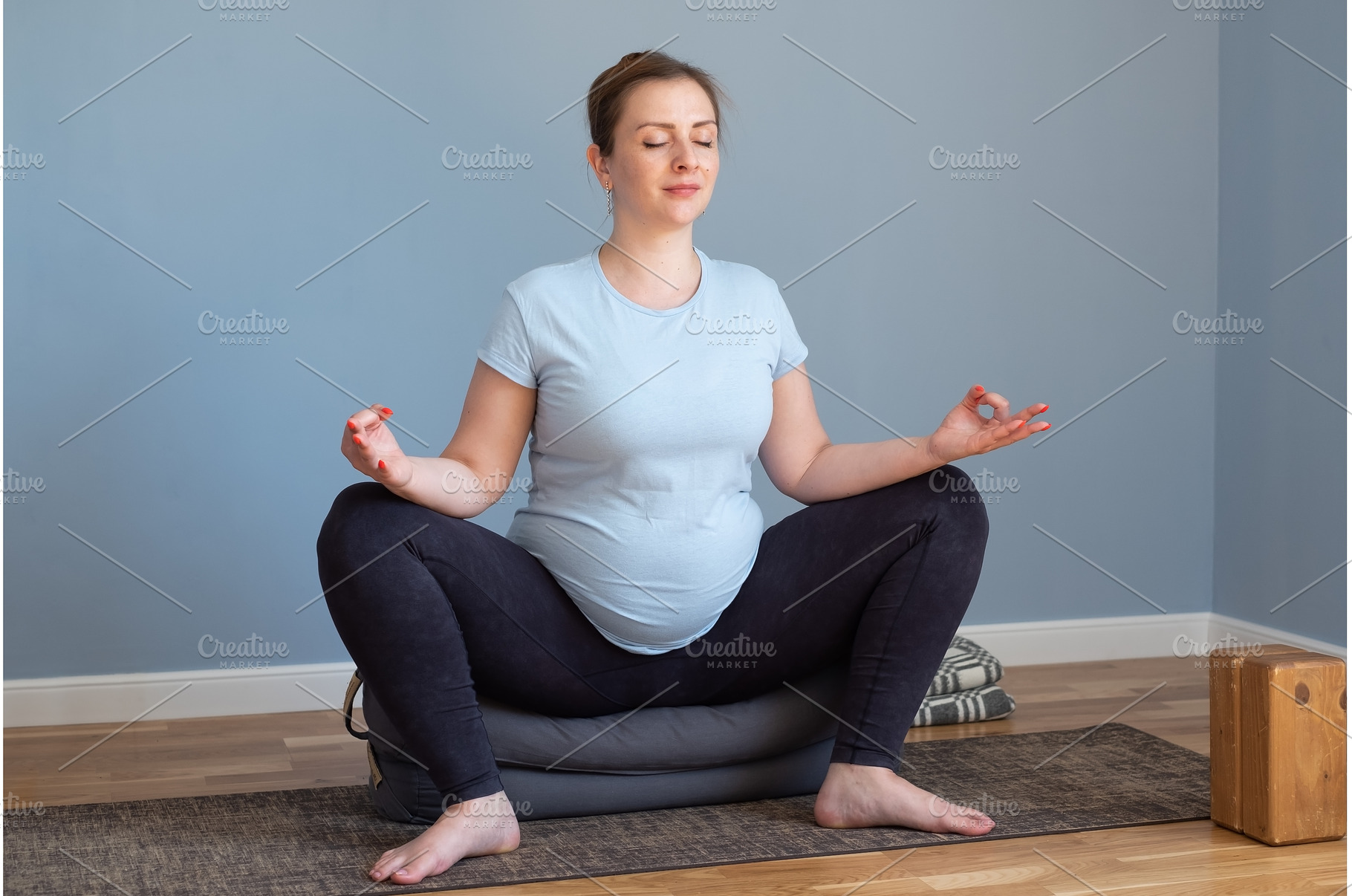 Pregnant yoga woman enjoying yoga, a Sports & Recreation Photo by Koldunov
