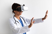 Black Doctor Using Virtual Reality Headset For Medical Purposes, a Photo by Prostock-Studio (Thumbnail 2 of 2)