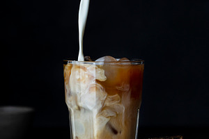 Iced coffee in a glass with milk
