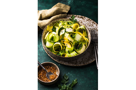 Raw sliced zucchini vegan pasta or, a Food & Drink Photo by Yulia Furman