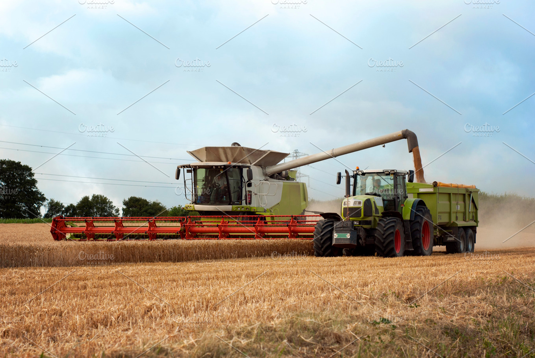 Combine harvester in wheat field, an Industrial Photo by lo-stock