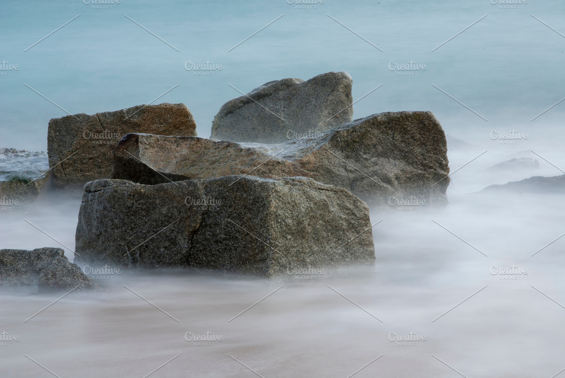 Rocks in the Seashore with a long exposure and silky water, a Nature Photo by RF Images