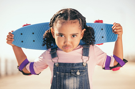 Summer, skateboard and portrait of girl at beach promenade for sports, freedom and training. Wellness, energy and comic with face of child and toys for youth, vacation and seashore lifestyle, a Photo by Peopleimages.com