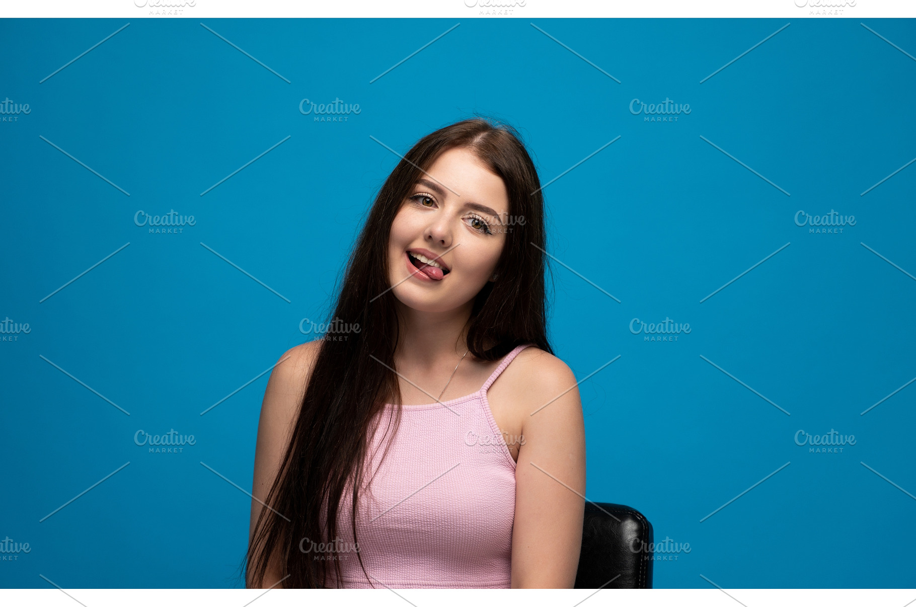 Playful young woman with long dark, a Person Photo by volodymyrshtun13795