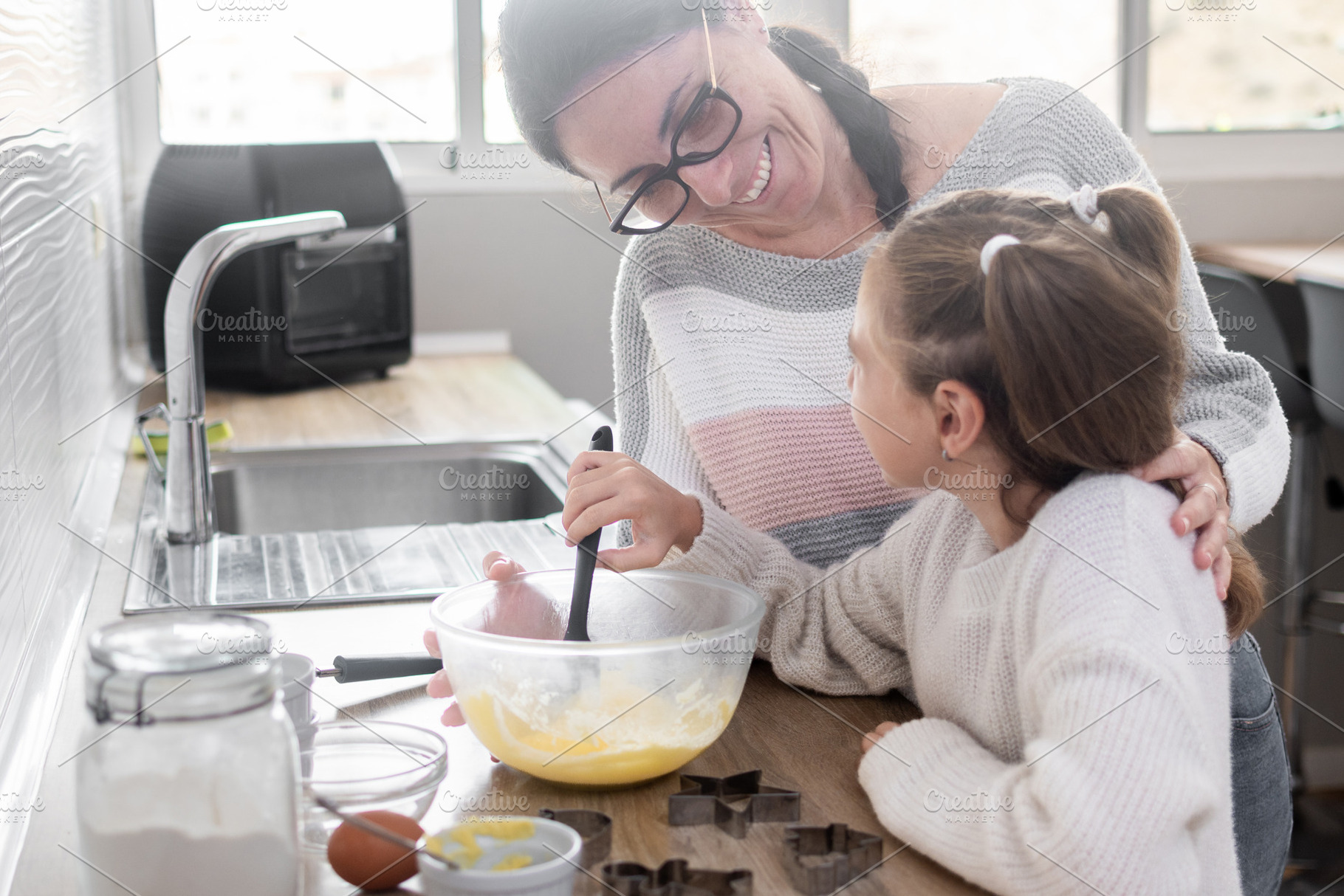 Mother and daughter preparing Christmas cookie dough together at home, a Person Photo by etorres69