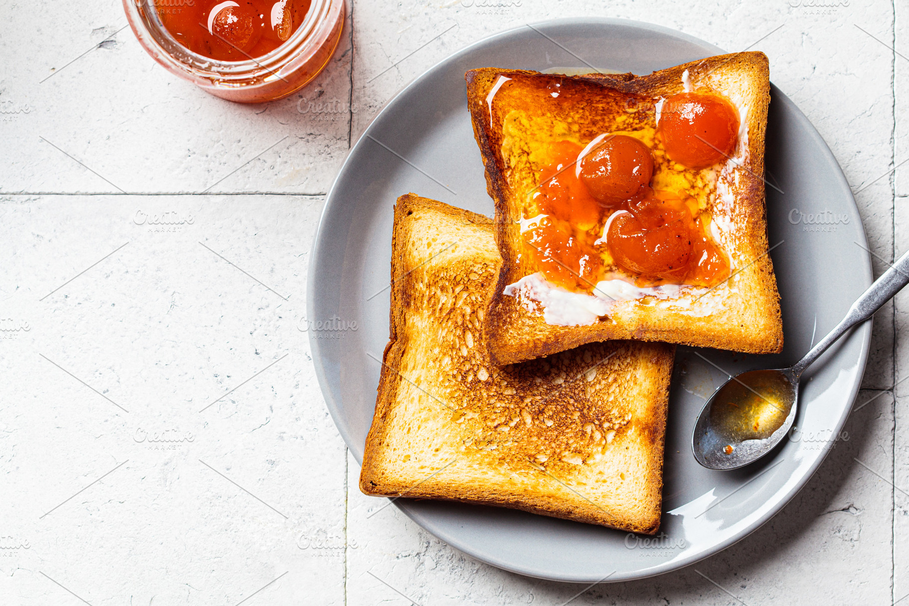 Toast with butter and apricot jam, a Food & Drink Photo by vaaseenaa