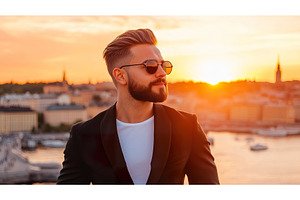 Stylish man in sunglasses at golden, a Person Photo by Lermont51