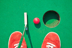 Miniature golf featuring miniature golf, minigolf, and mini golf