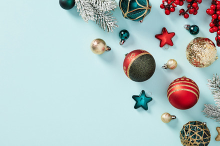 Vintage Christmas decorations and baubles on pastel blue table. Winter holiday, a Holiday Photo by photoguns
