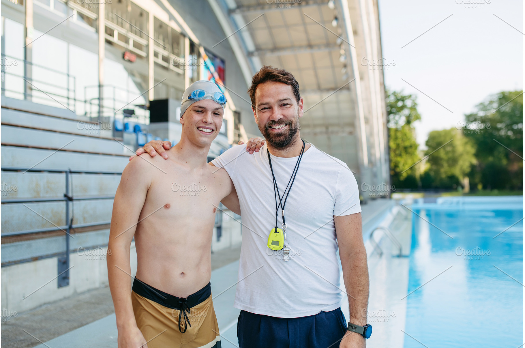 Portrait of coach with teen swimmer, a Sports & Recreation Photo by HalfPoint