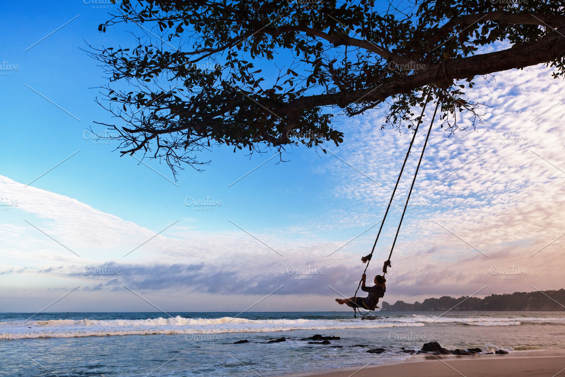 Happy girl have fun swinging high in featuring family, vacation, and happy, a Person Photo by Tropical Studio